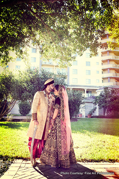 Indian groom Kissing Forehead of Indian Bride