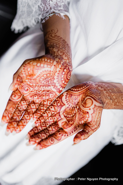 Beautiful woman in traditional Muslim Indian wedding pink sari dress hands  with henna tattoo mehndi pattern jewelry and bracelets hold burning lotus  candle Summer culture festival celebration concept Stock Photo | Adobe