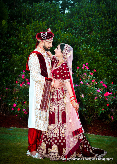 Indian bride and groom posing outside