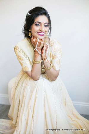 Bride showing her mehndi designs