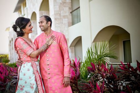 Adorable Indian bride and groom face to face   portrait.