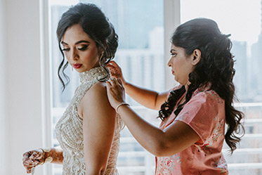 Bridesmaids help Indian Bride Getting Ready