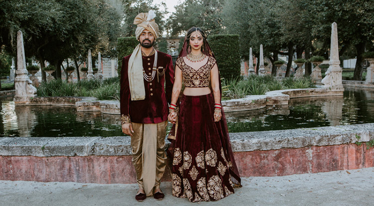 Charming Indian Bride and Groom Holding hands 
