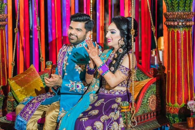 Indian Bride and Groom having fun at the sangeet Celebrations