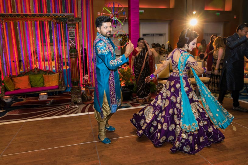 Indian Bride and Groom doing Garba at Sangeet Ceremony