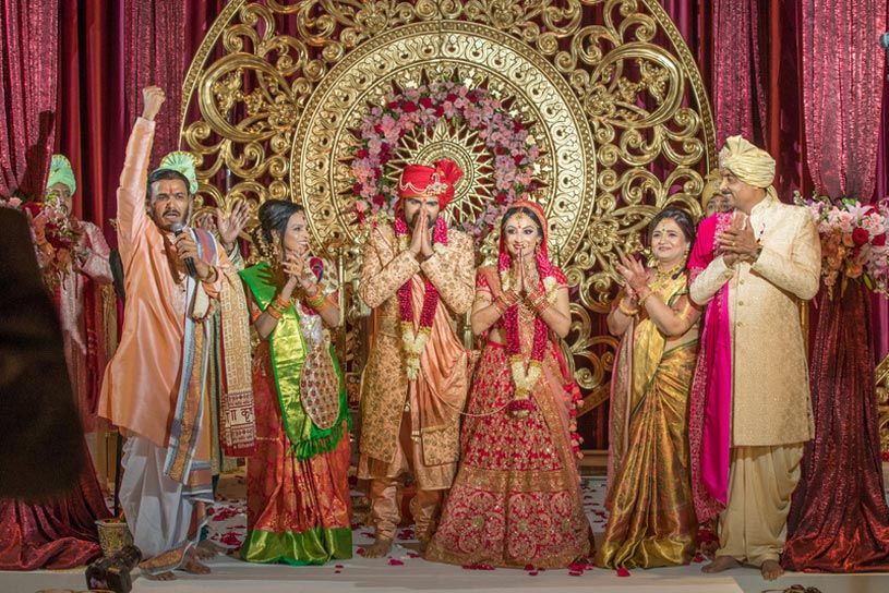 Indian bride and groom during the ceremony under the Mandap