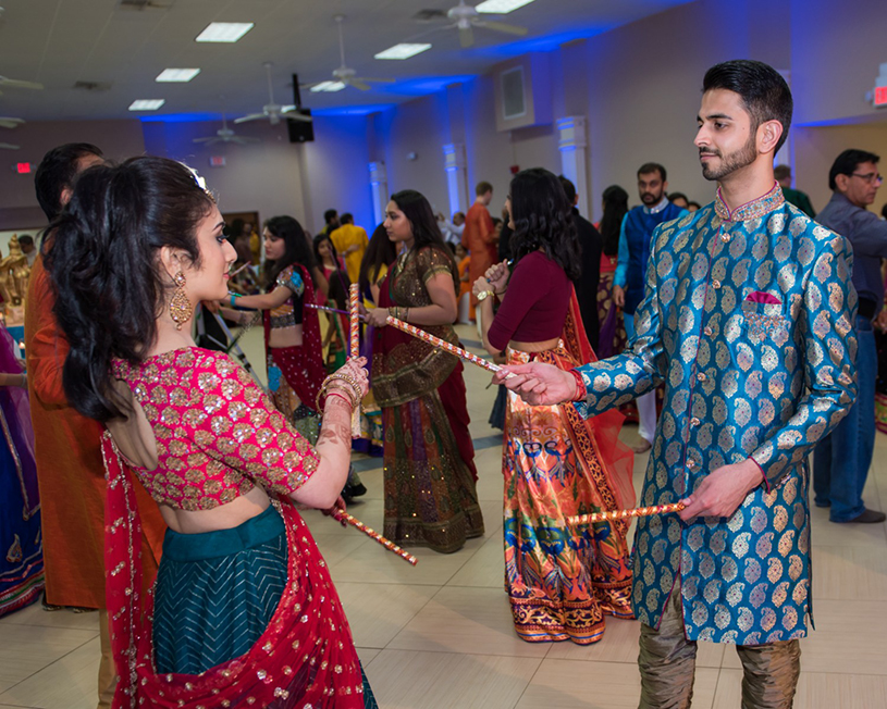 Lovely Indian Couple Playing Raas Garba