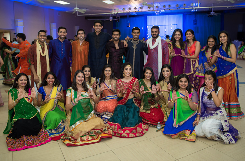 Indian Bride and Bridesmaids showing their Mahendi Design