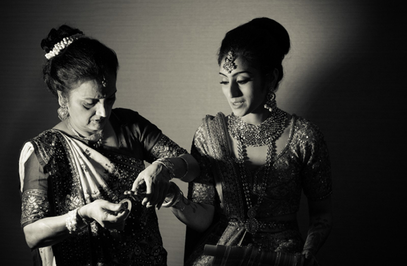 Indian Bride's Mother helping Indian Bride to Getting Ready