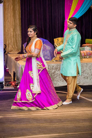 Indian Bride and Groom Doing Garba 