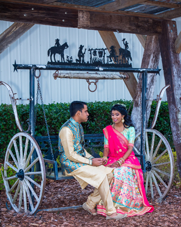 Indian Bride and Groom Holding Hands at Sangeet Ceremony