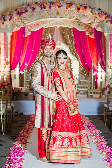 Indian Bride and Groom Capture Under Wedding Mandap Indian Bride and Groom Capture Under Wedding Mandap