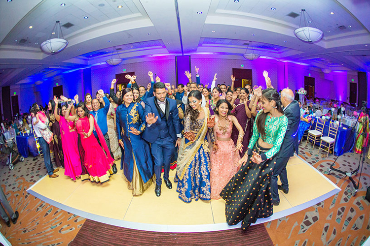 Indian Bride ang Groom Dancing with their Guest Capture