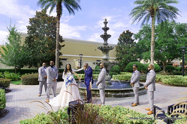 Beautiful shot of Indian couple with the Groomsmen