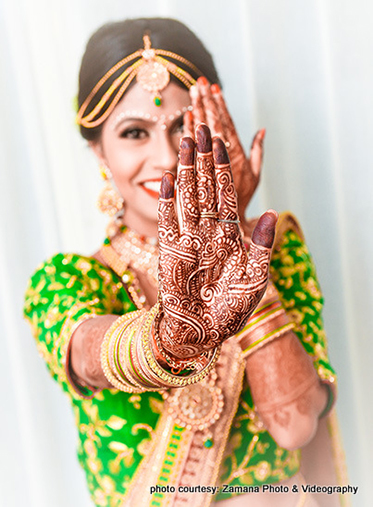 Indian Bride Showing her Beautiful Wedding Mahendi 
