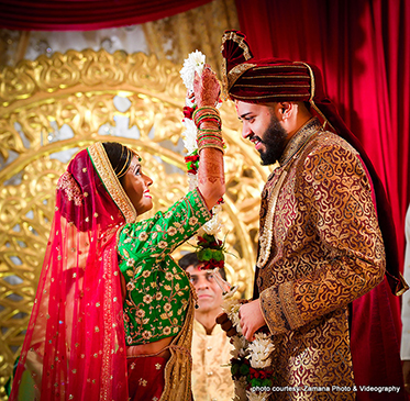 Indian Groom and IndianBride at their Garland procession