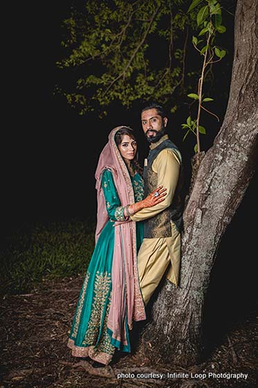 Indian Bride and Groom Possing for Outdoor Photoshoot in Sangeet Outfit