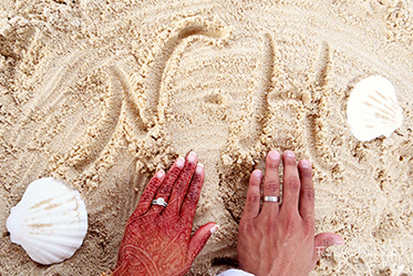 Engraving the initials in the sand