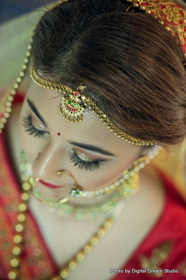 Shot of the amazing bride wearing the tikka