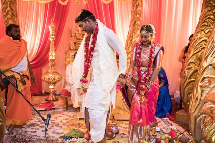 Indian Bride and Groom Walking together holding Hands