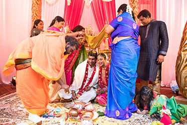 Indian Bride and Groom's Guest Holding Cloth for them