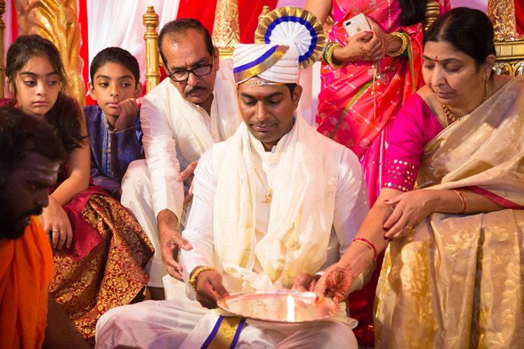 Indian Groom Holding Plate with water