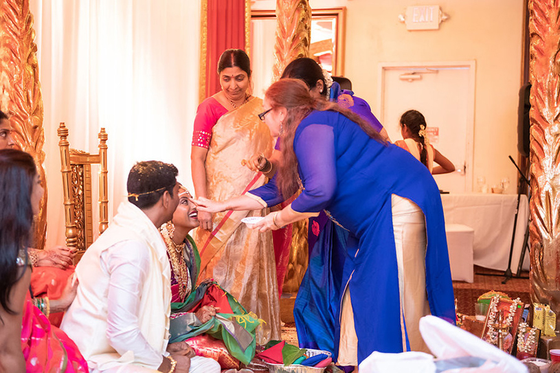 Indian Wedding Guest Doing Wedding Ritual