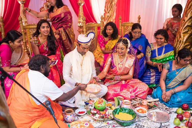 Indian Bride and Groom Holding Diya in their Hands