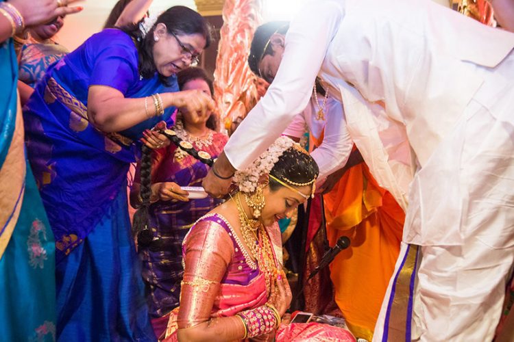 Indian Groom Puts on Bride's Neck Mangalsutra