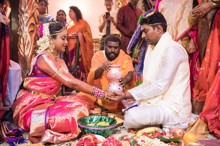 Indian Bride and Groom Holding Pots