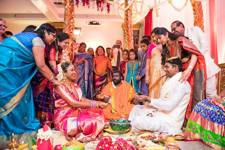 Indian Groom and Bride Holding Grains in their Hands