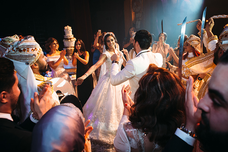 Indian Bride and Groom Dancing With Their Guest