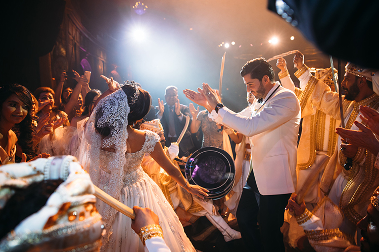 Indian Groom Encouraging Indian Bride's Dance