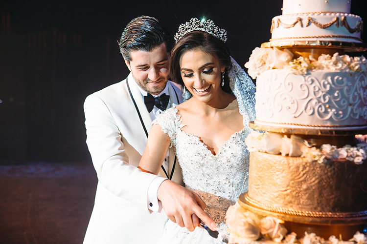 Indian Bride and Groom Cutting Cake