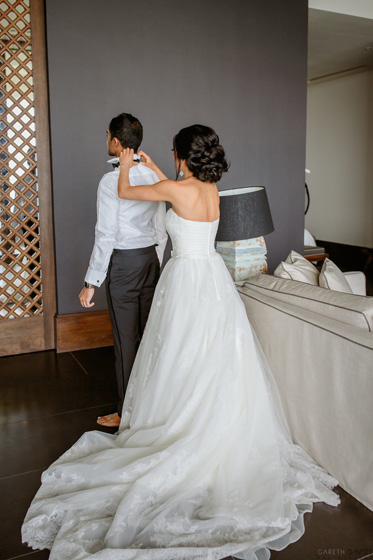 Indian Bride Helping Groom for Getting Ready