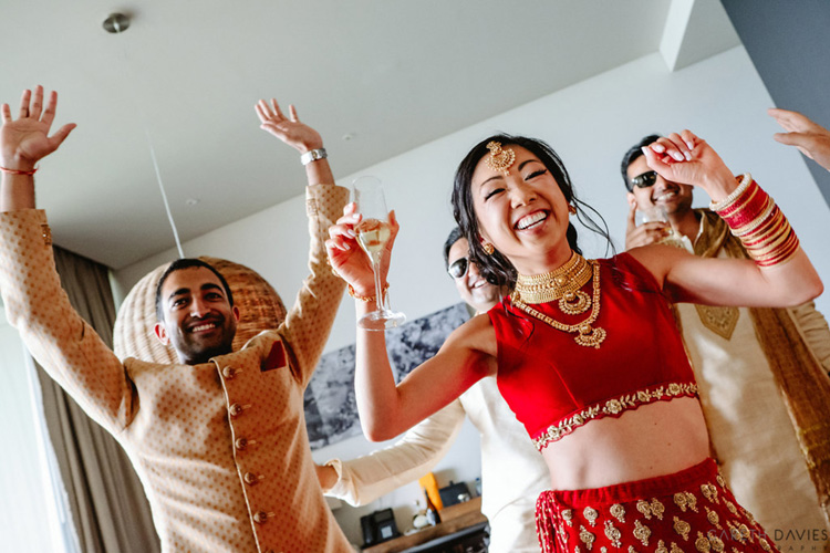 Indian Bride and Groom Dancing with Goomsmen