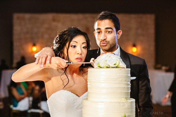 Indian Bride and Groom Cutting the Cake