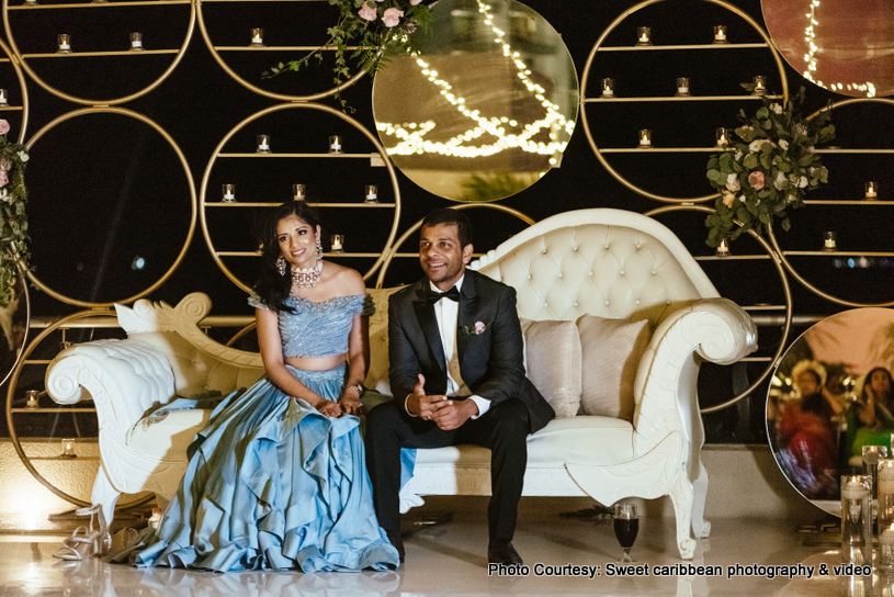 Indian couple posing at the reception