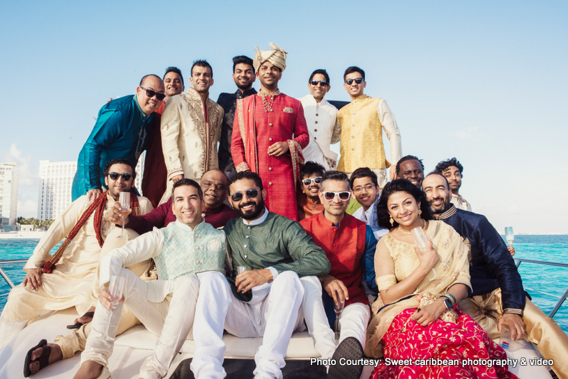 Indian Groom with his family posing outdoors