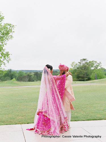 Indian Couple Posing with bridesmaids and groomsmen