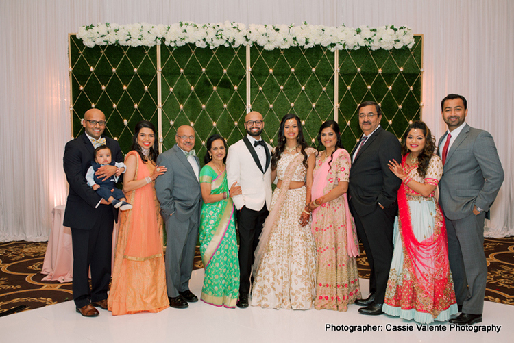 Indian Couple Posing with bridesmaids and groomsmen
