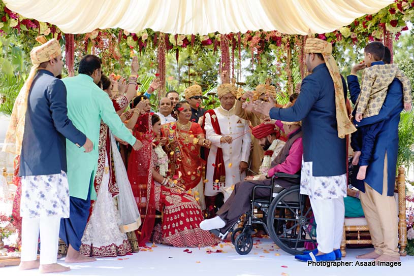 Indian Wedding Guest with Indian Bride and Groom 