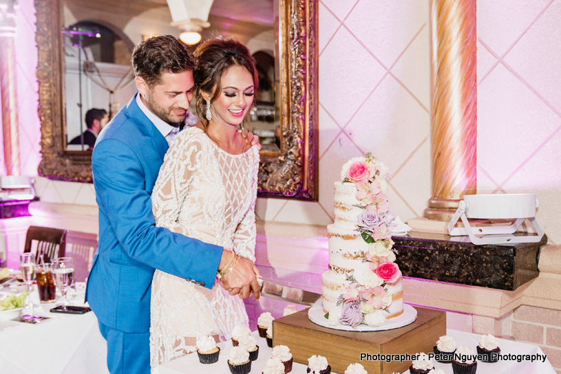 Newly Weds Cutting Wedding Cake