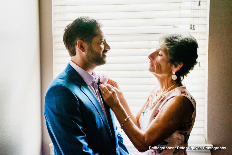 Indian Mother getting TIE done of indian Groom