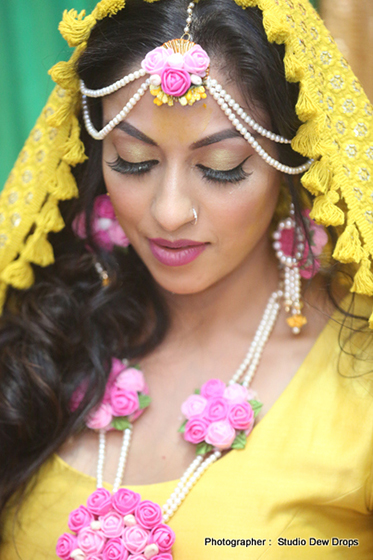 Indian Bride's Family Apply Haldi on her face at Haldi Ceremony