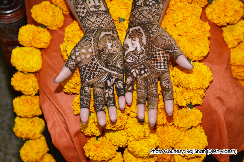 henna is applied on the bride’s hands and feet in anticipation of the wedding ceremony