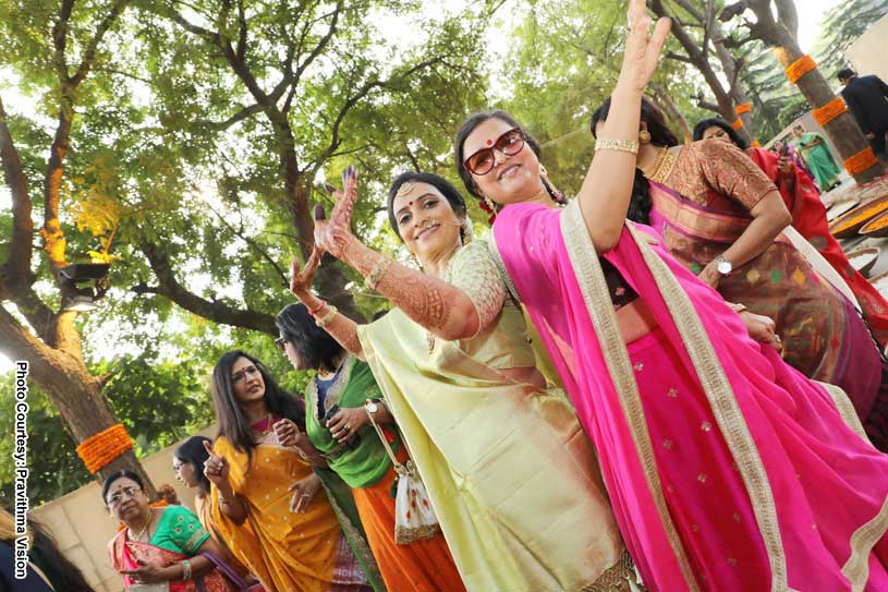 Groom's mother and Bride's Mother dancing at the Baraat