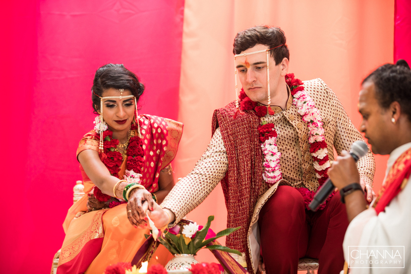 Wedding couple putting Ghee in Havan Kund