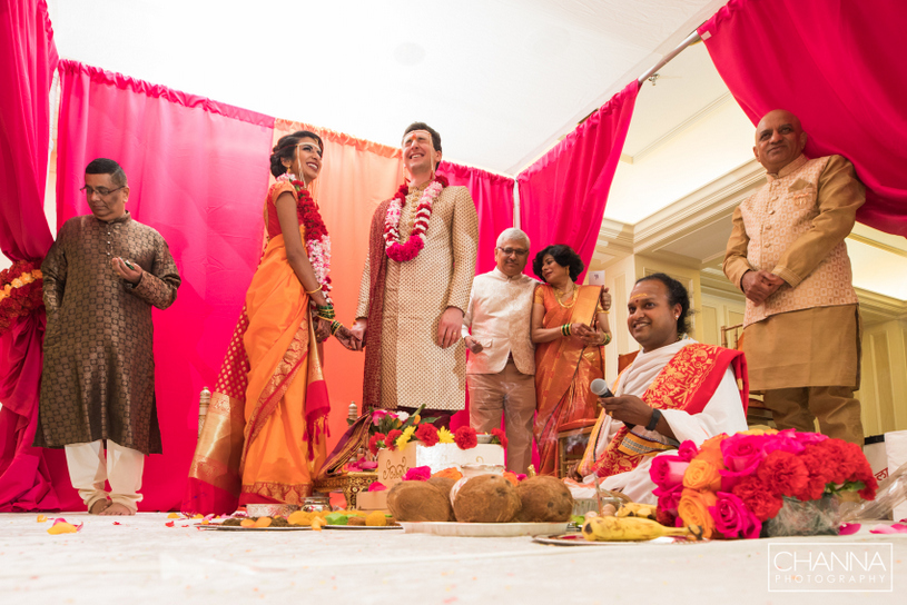 sweet couple holding hands during ceremony