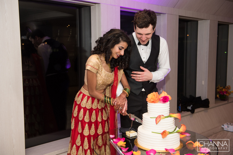 Wedding couple cutting cake during Reception Ceremony